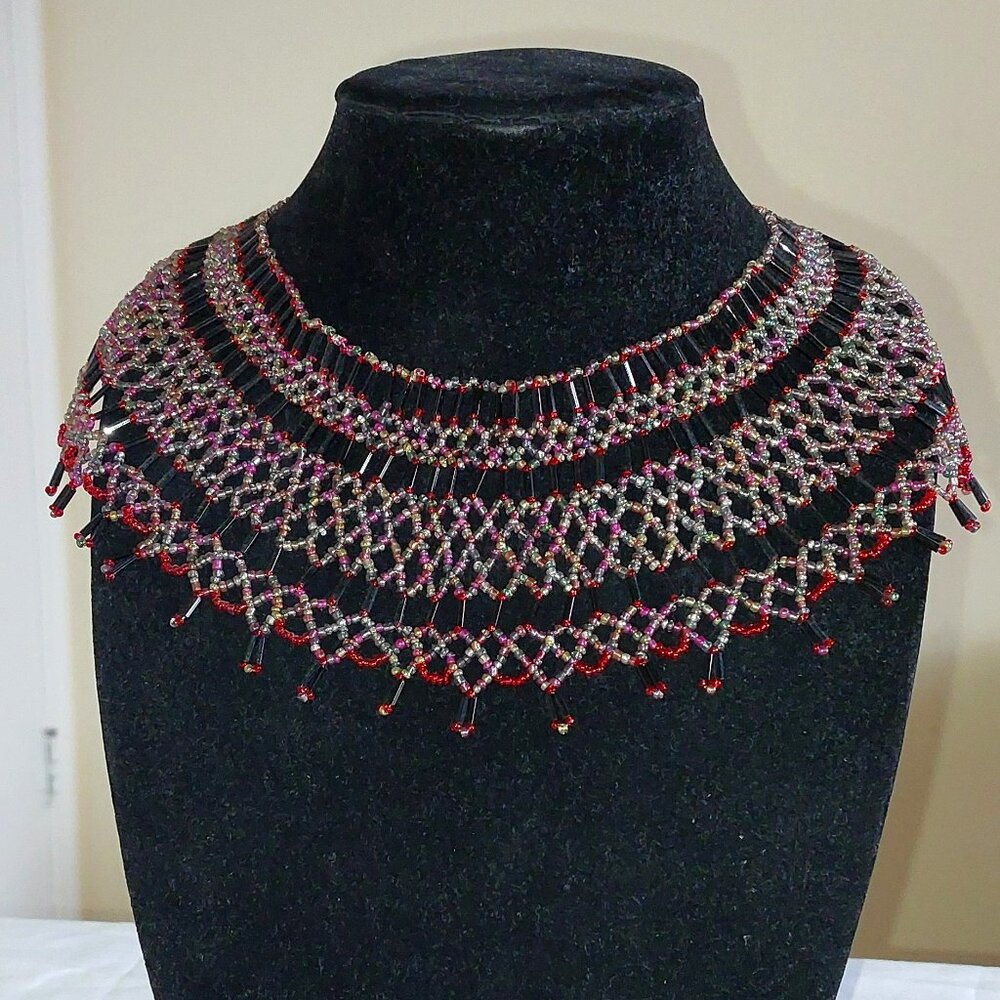 Multicolored ethnic inspired necklace netted from glass seed beads.